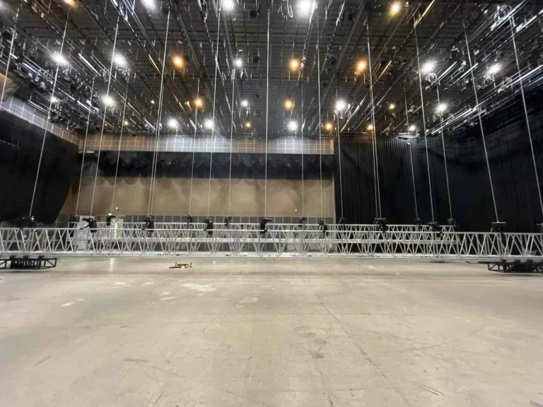 Concert rigging application showing stage hoist use for LED walls, lighting trusses, and scenic lifting